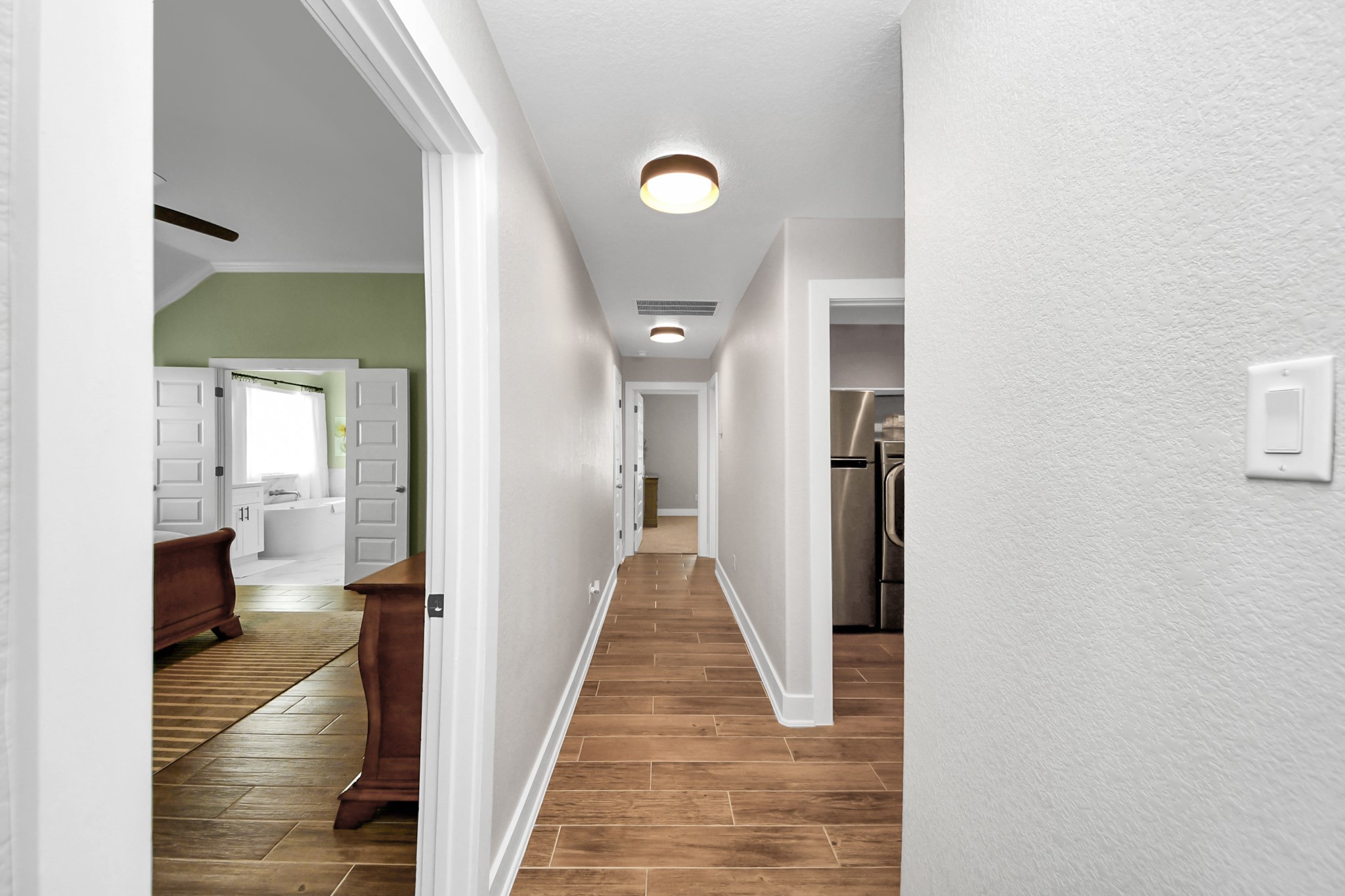 7723 Stratford Hall Drive Rosharon, TX 77583 - Photo 29 of 50 Hallway to Primary Bedroom, Laundry Room, Mud Room, Bedroom #2 & Full Bathroom