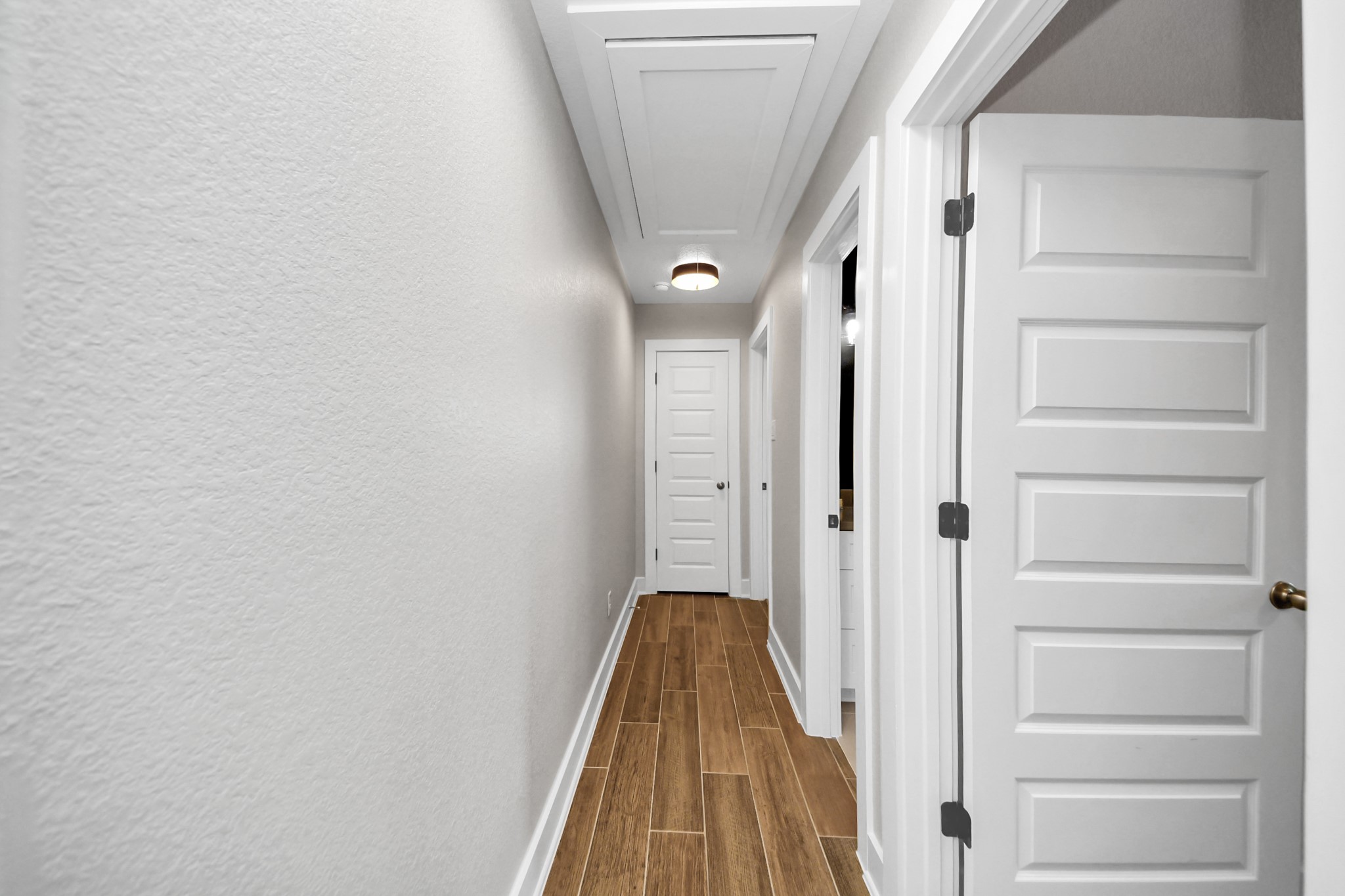 7723 Stratford Hall Drive Rosharon, TX 77583 - Photo 39 of 50 a view of a hallway with wooden floor and staircase