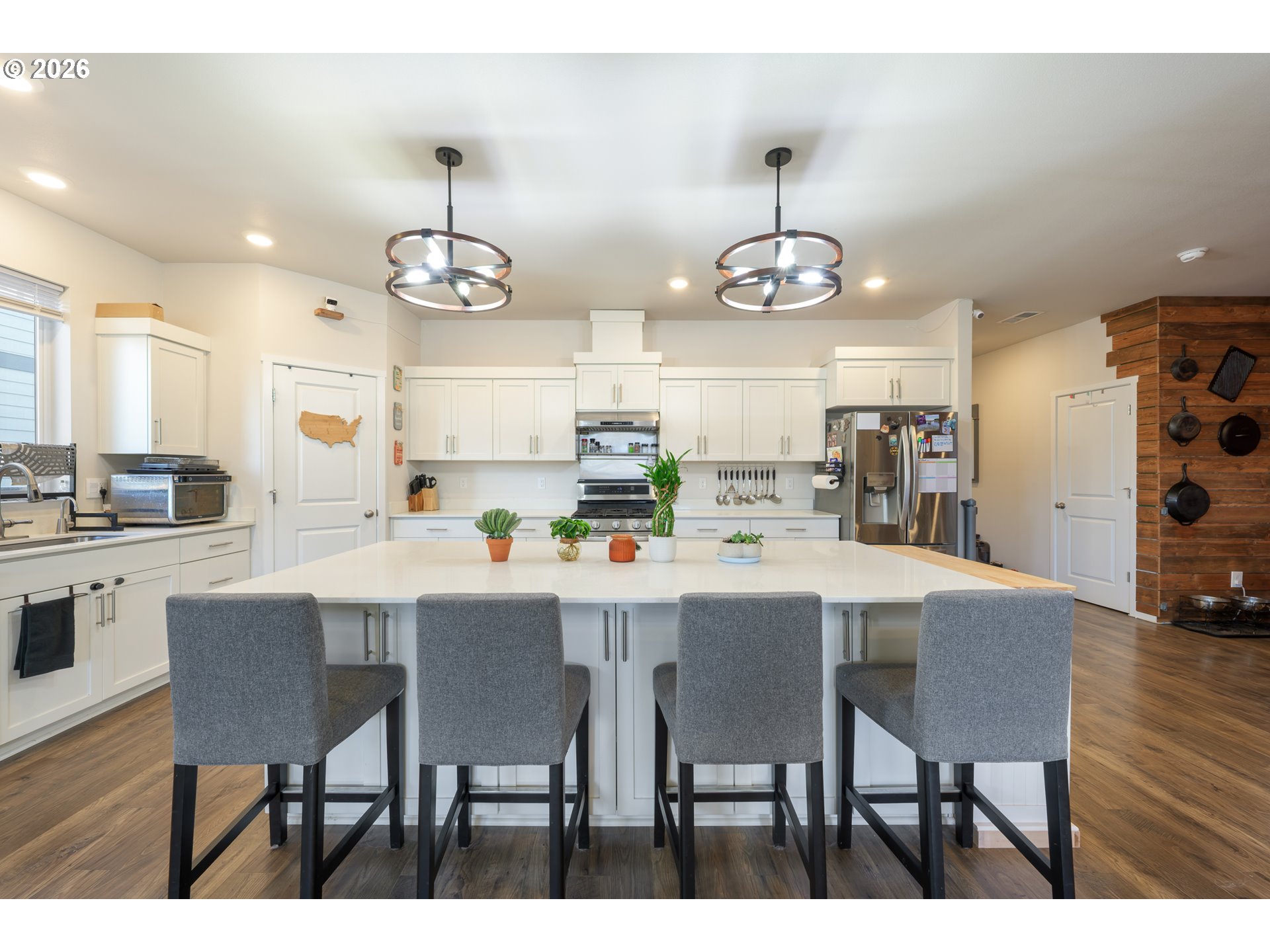 641 Northeast Union Loop Prineville, OR 97754 - Photo 5 of 23 a kitchen with kitchen island a dining table and chairs