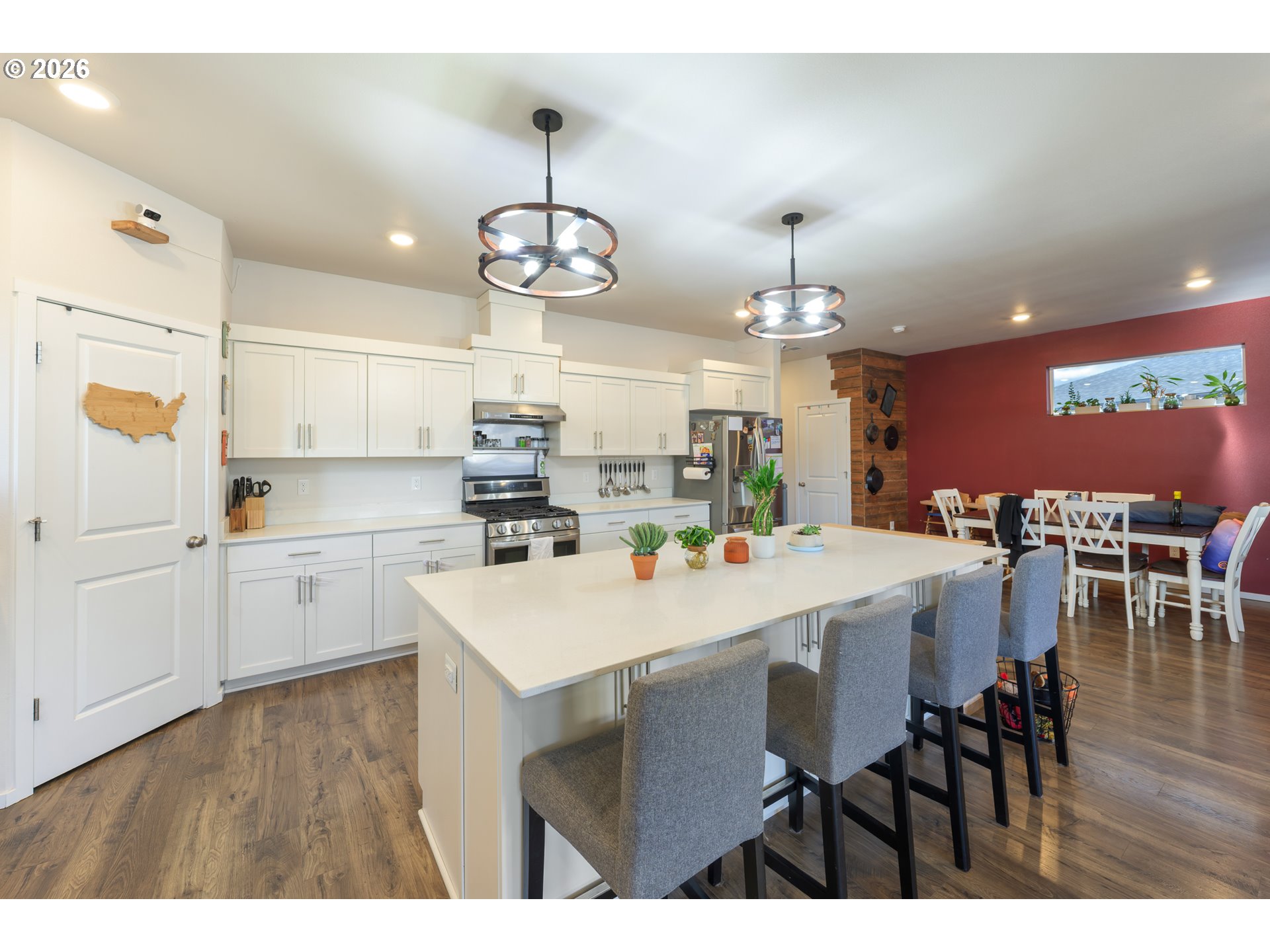 641 Northeast Union Loop Prineville, OR 97754 - Photo 8 of 23 a kitchen with a dining table chairs sink and cabinets