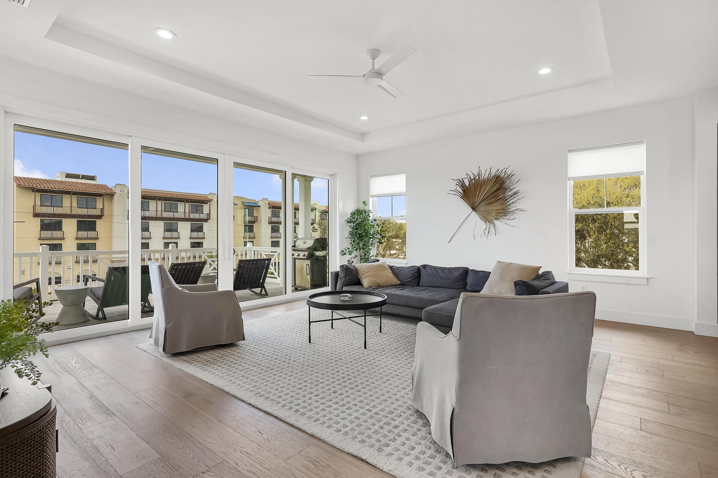 104 7th Street St. Augustine, FL 32080 - Photo 16 of 59 Living area with ceiling fan, hardwood / wood-style floors, a tray ceiling, and recessed lighting