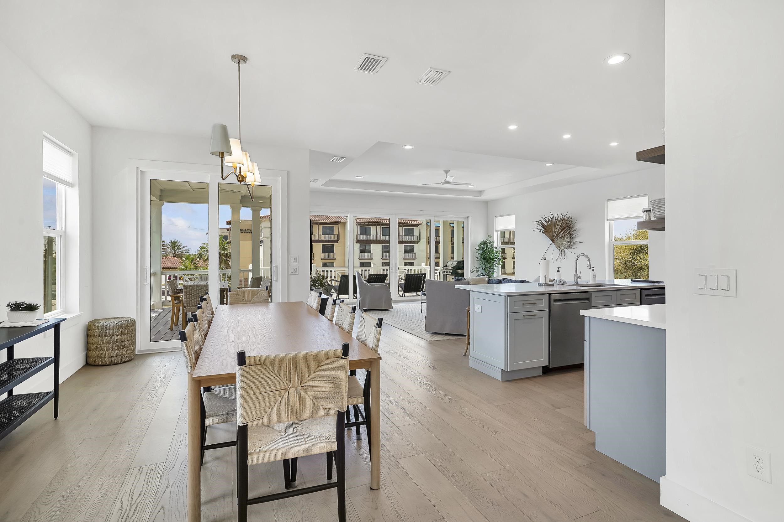 104 7th Street St. Augustine, FL 32080 - Photo 18 of 59 Dining area with a raised ceiling, light wood finished floors, recessed lighting, and a ceiling fan