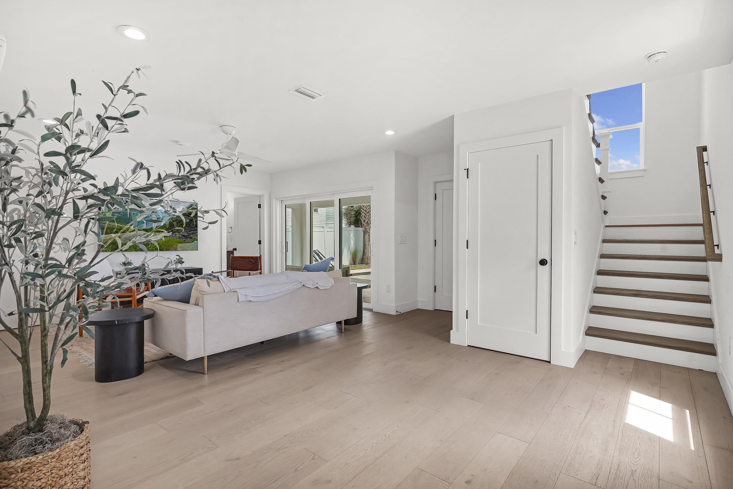 104 7th Street St. Augustine, FL 32080 - Photo 23 of 59 Living room with light wood finished floors and recessed lighting