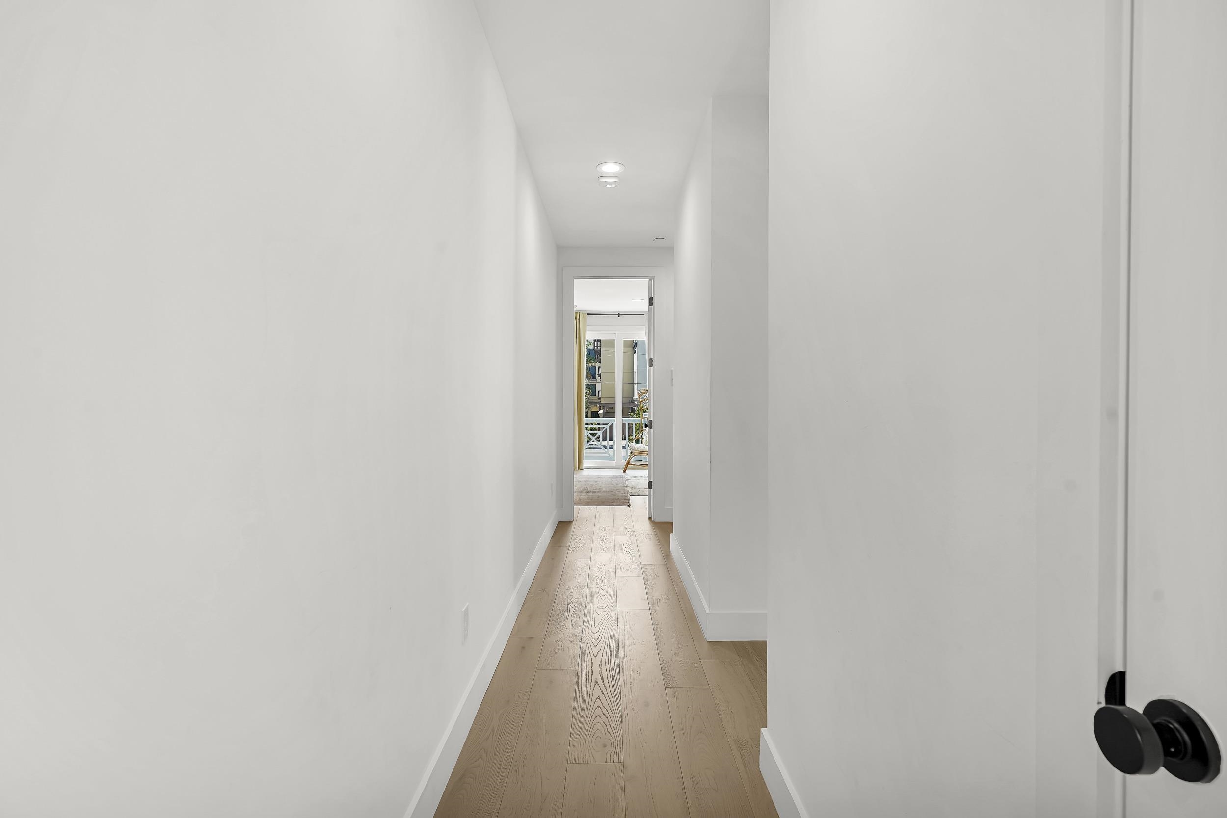 104 7th Street St. Augustine, FL 32080 - Photo 33 of 59 Hall featuring baseboards and light wood-type flooring