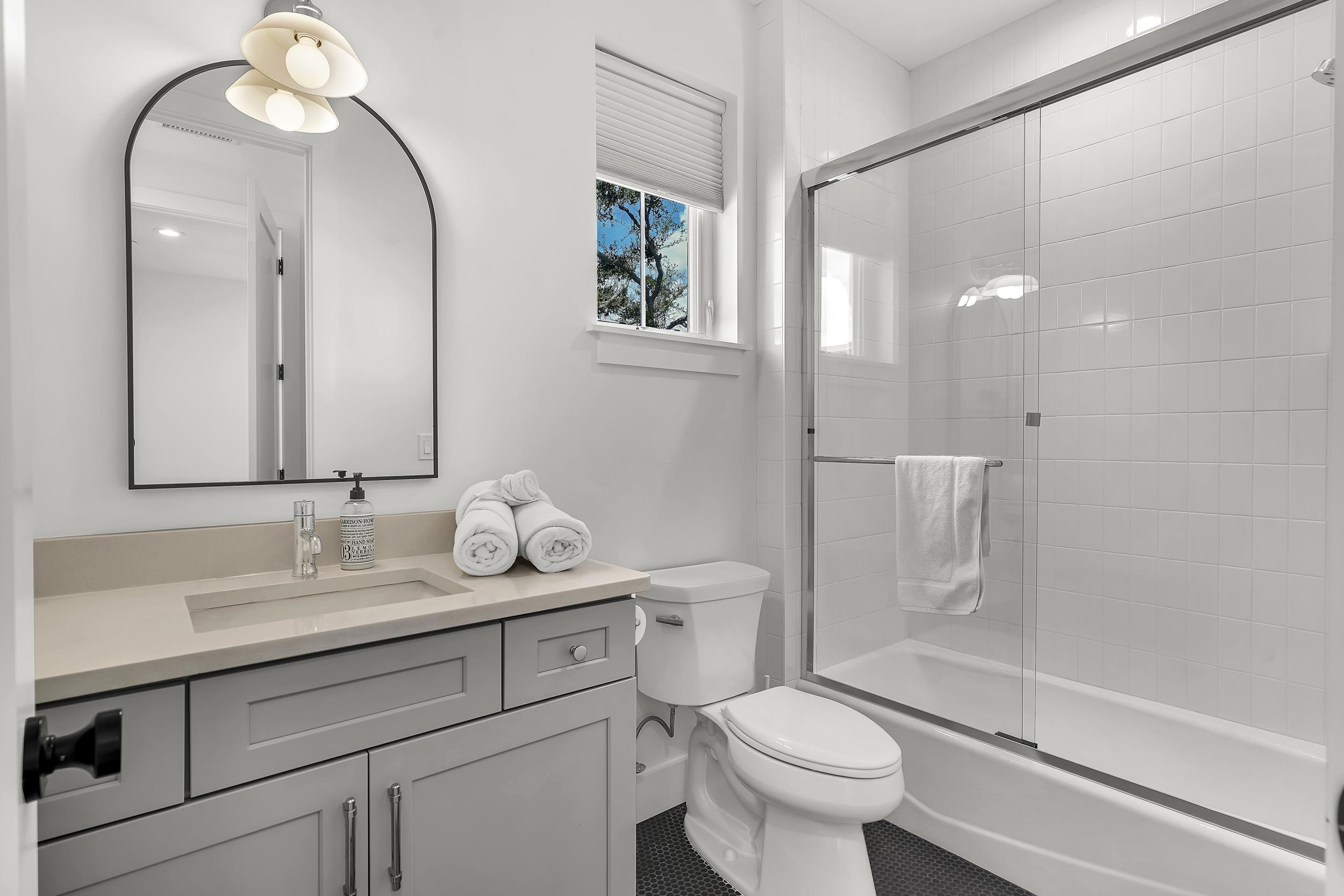 104 7th Street St. Augustine, FL 32080 - Photo 47 of 59 Full bath with vanity and combined bath / shower with glass door