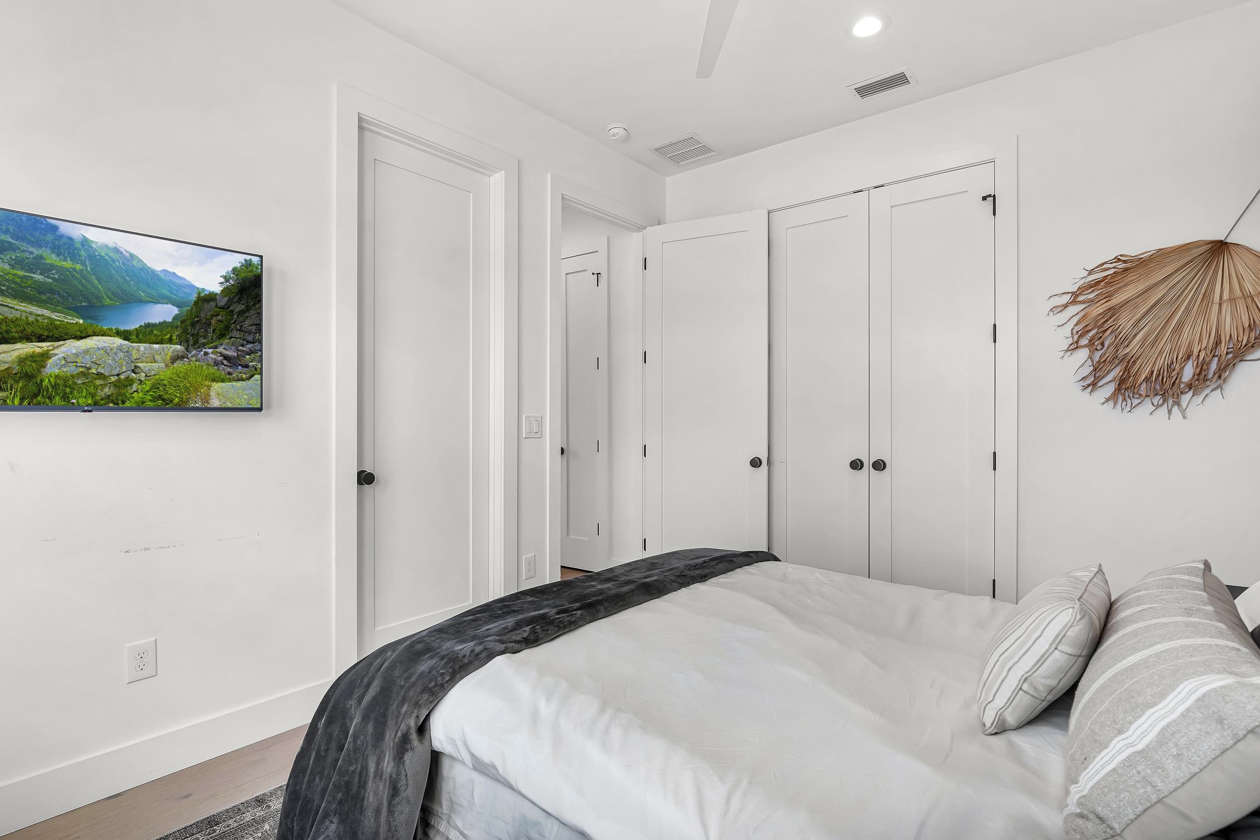 104 7th Street St. Augustine, FL 32080 - Photo 49 of 59 Bedroom with wood finished floors, ceiling fan, and a closet