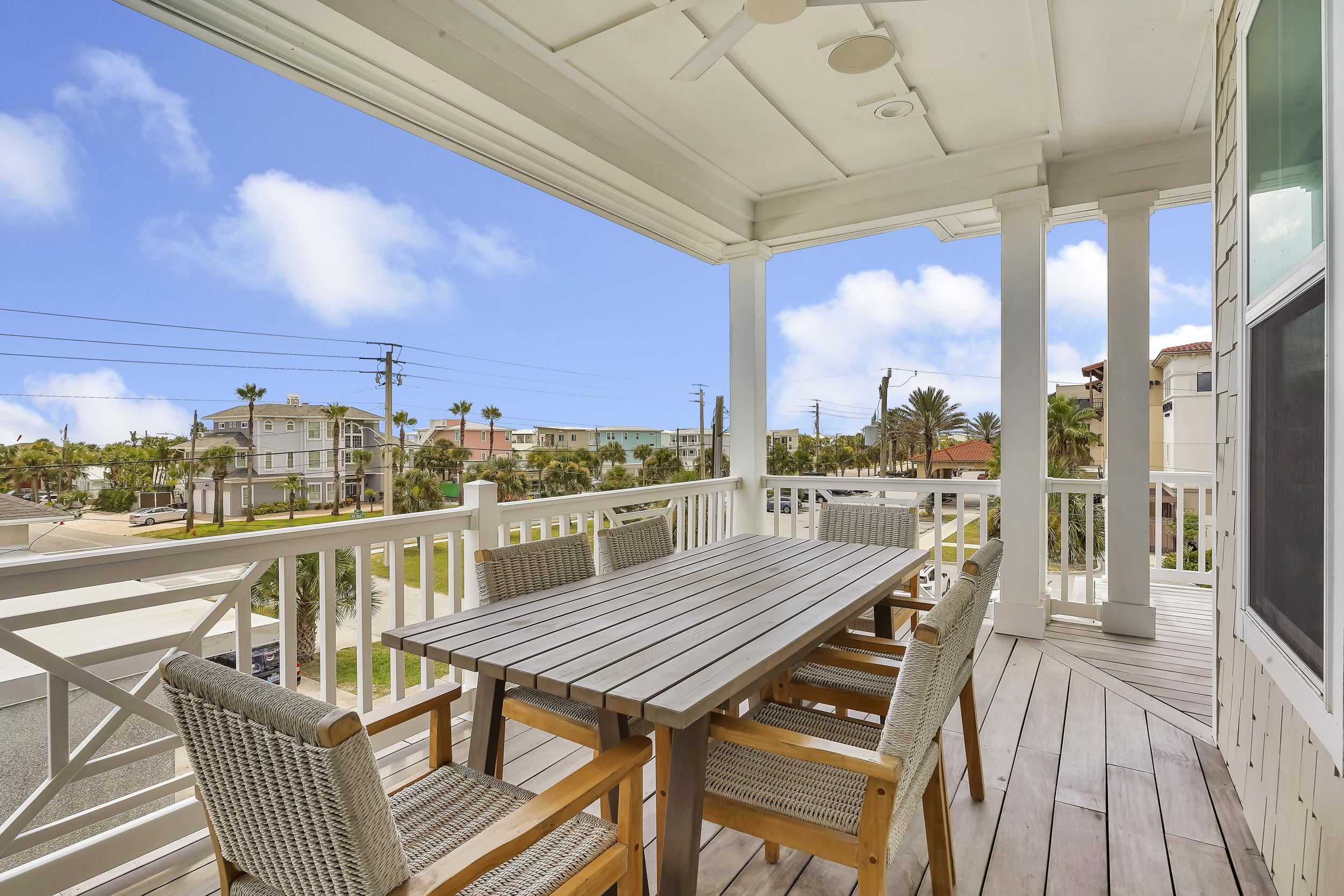 104 7th Street St. Augustine, FL 32080 - Photo 51 of 59 Wooden deck featuring a residential view, outdoor dining space, and a ceiling fan