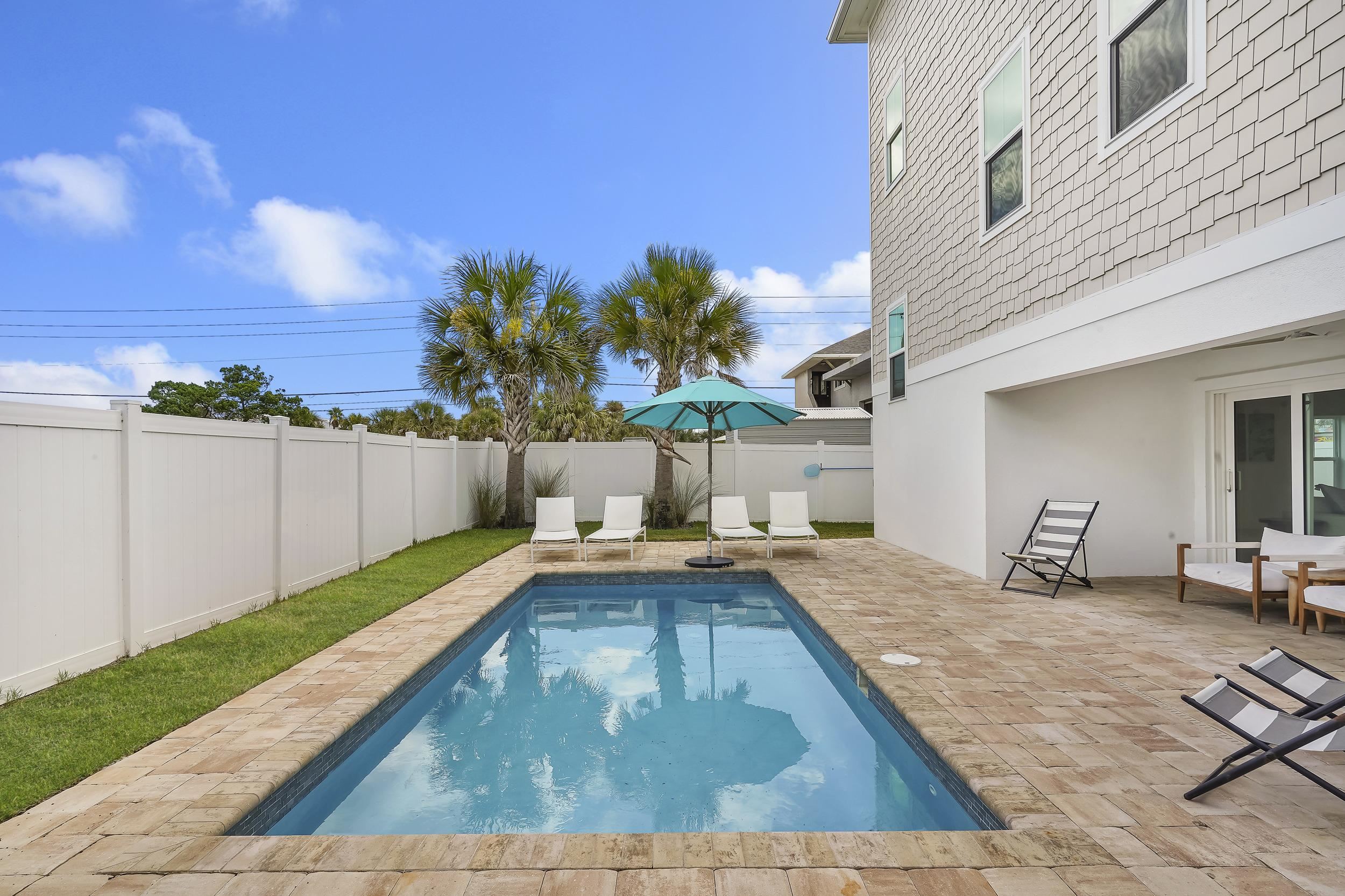 104 7th Street St. Augustine, FL 32080 - Photo 53 of 59 View of pool with patio surround and a fenced backyard