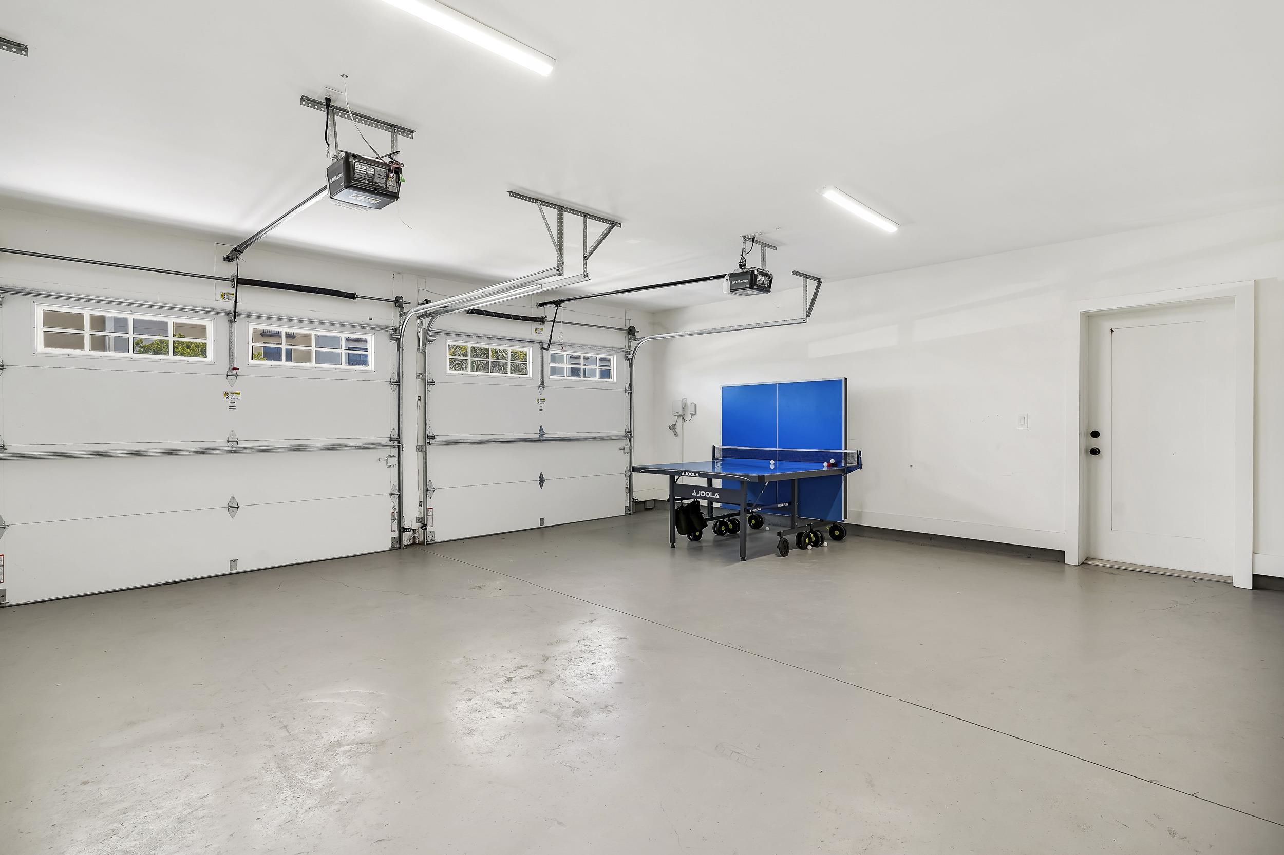 104 7th Street St. Augustine, FL 32080 - Photo 55 of 59 Garage featuring a garage door opener