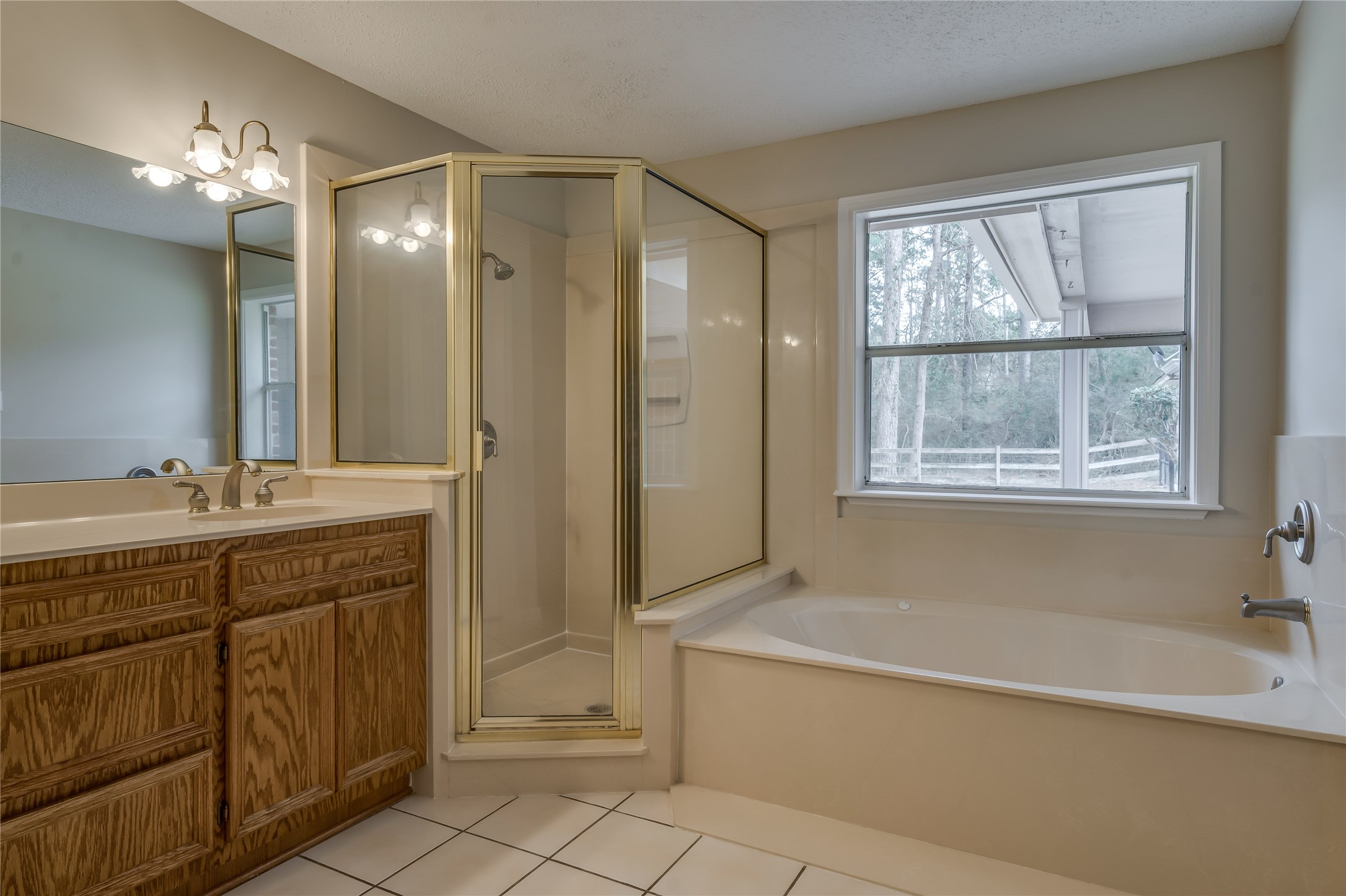 2460 Pebblebrook Circle Conroe, TX 77384 - Photo 18 of 27 Double sinks, garden tub and separate shower