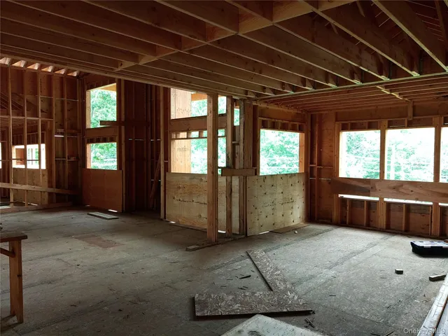 a view of an empty room with windows