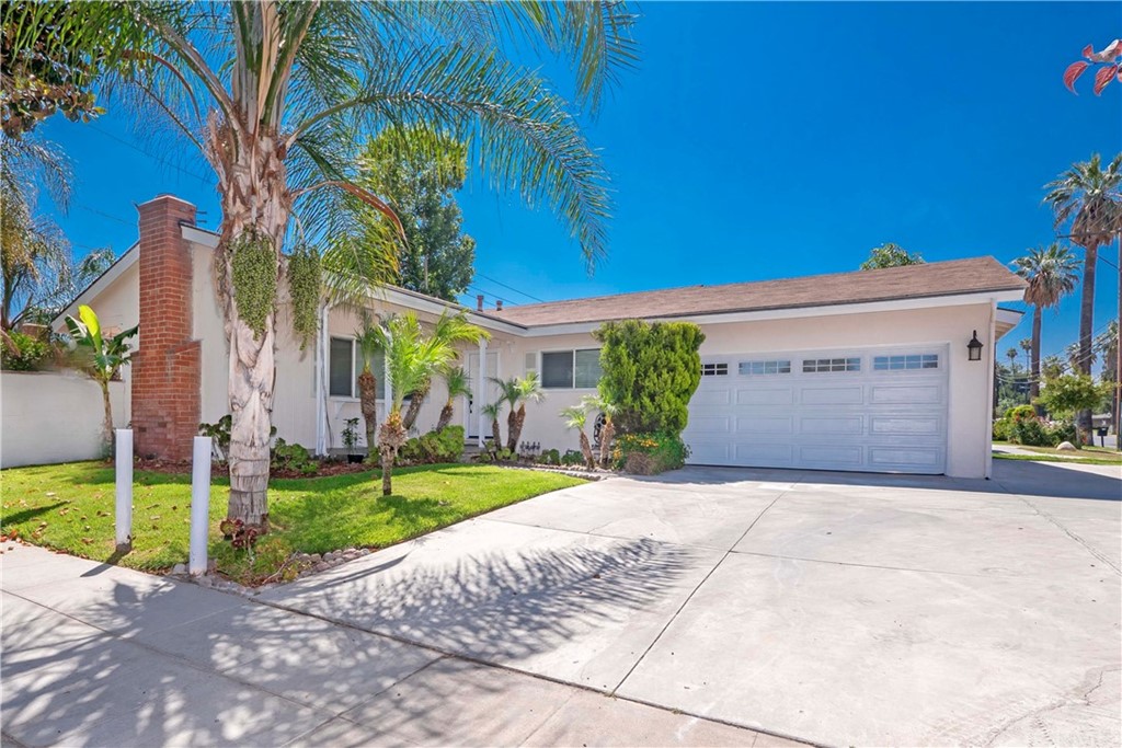 4195 Adams Street Riverside, CA 92504 - Photo 1 of 1 a front view of a house with a yard and garage