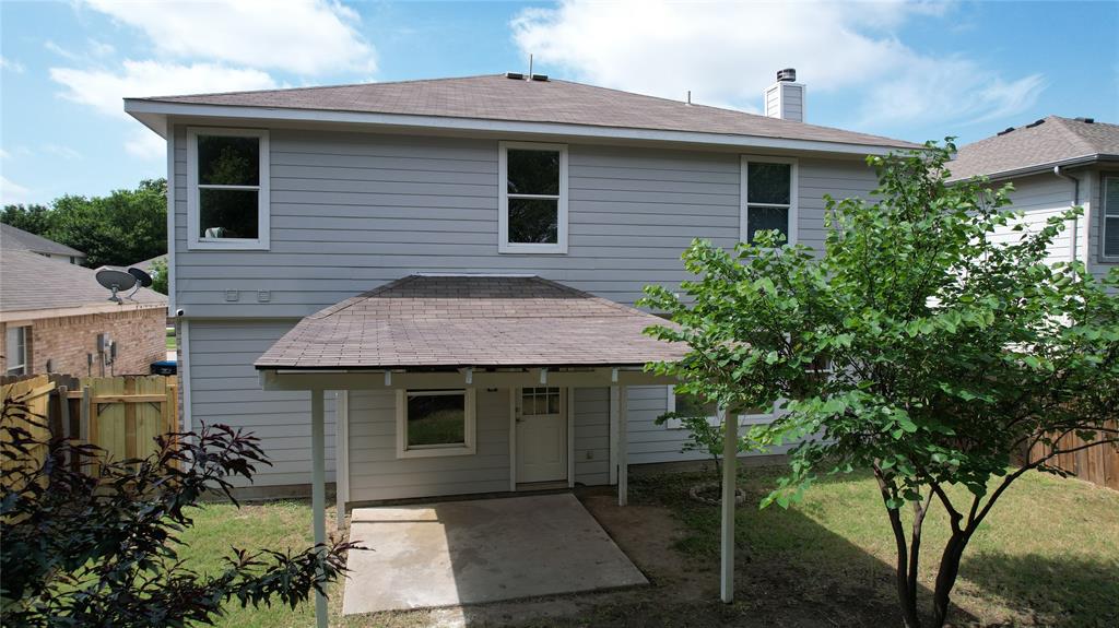 3437 Caprock Ranch Road Fort Worth, TX 76262 - Photo 27 of 27 a front view of a house with a garden