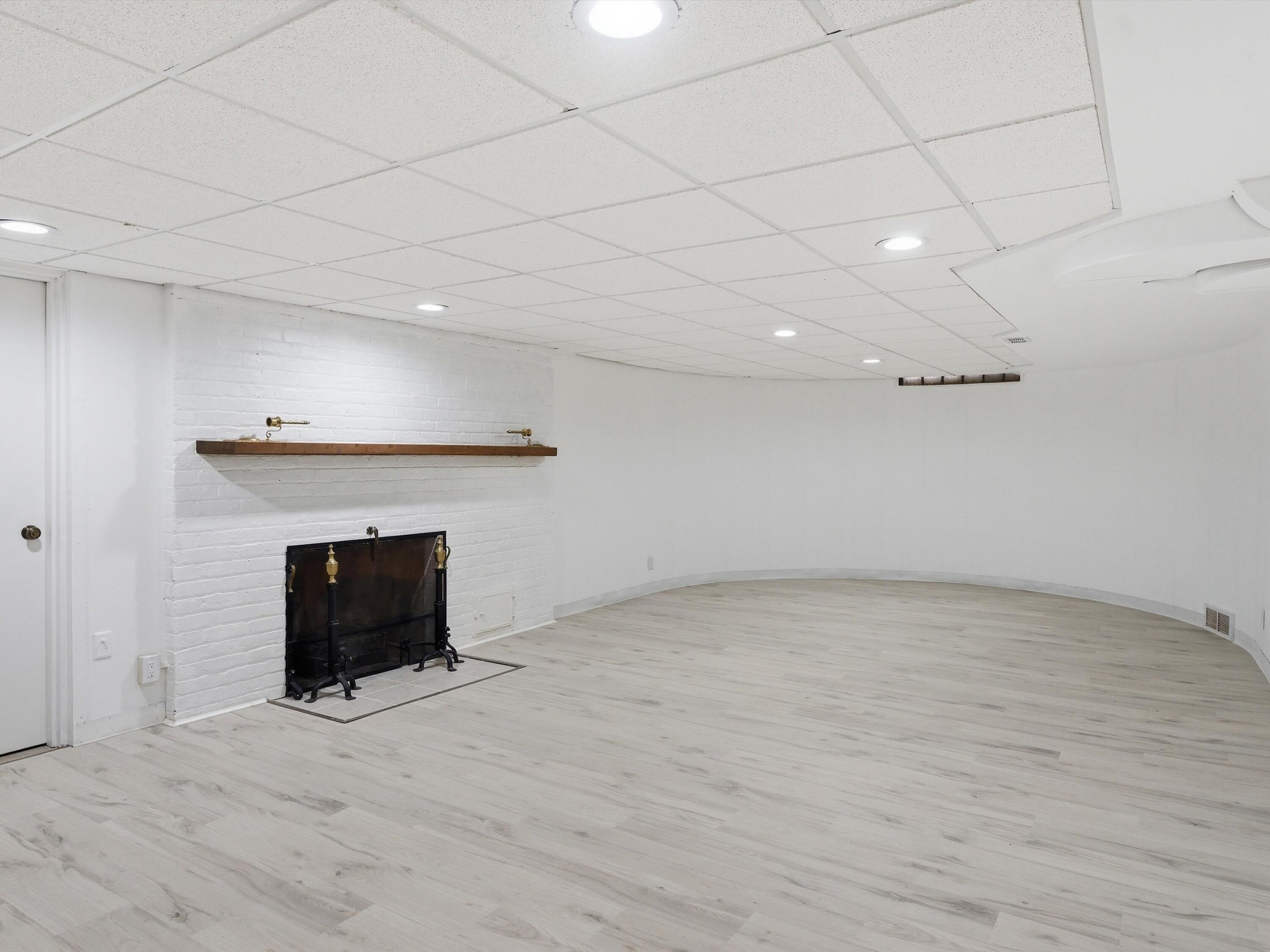 1608 North Rapids Road Manitowoc, WI 54220 - Photo 55 of 72 All purpose/Recroom, Fireplace all new flooring