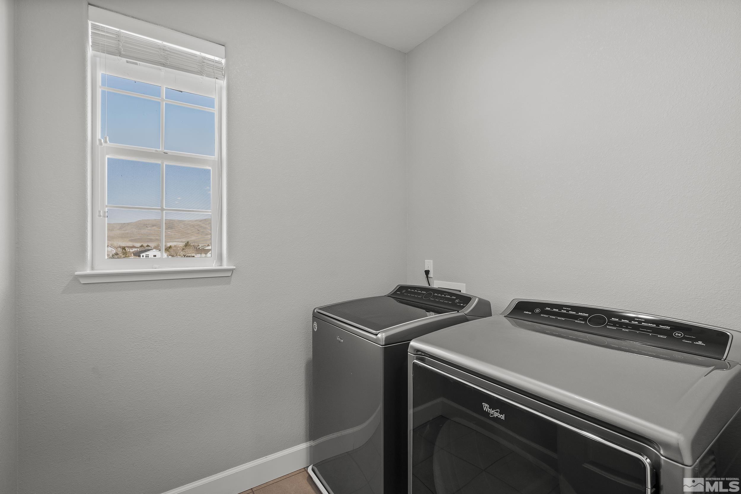 2037 Wind Ranch Road, Unit A Reno, NV 89521 - Photo 23 of 39 a utility room with dryer and washer