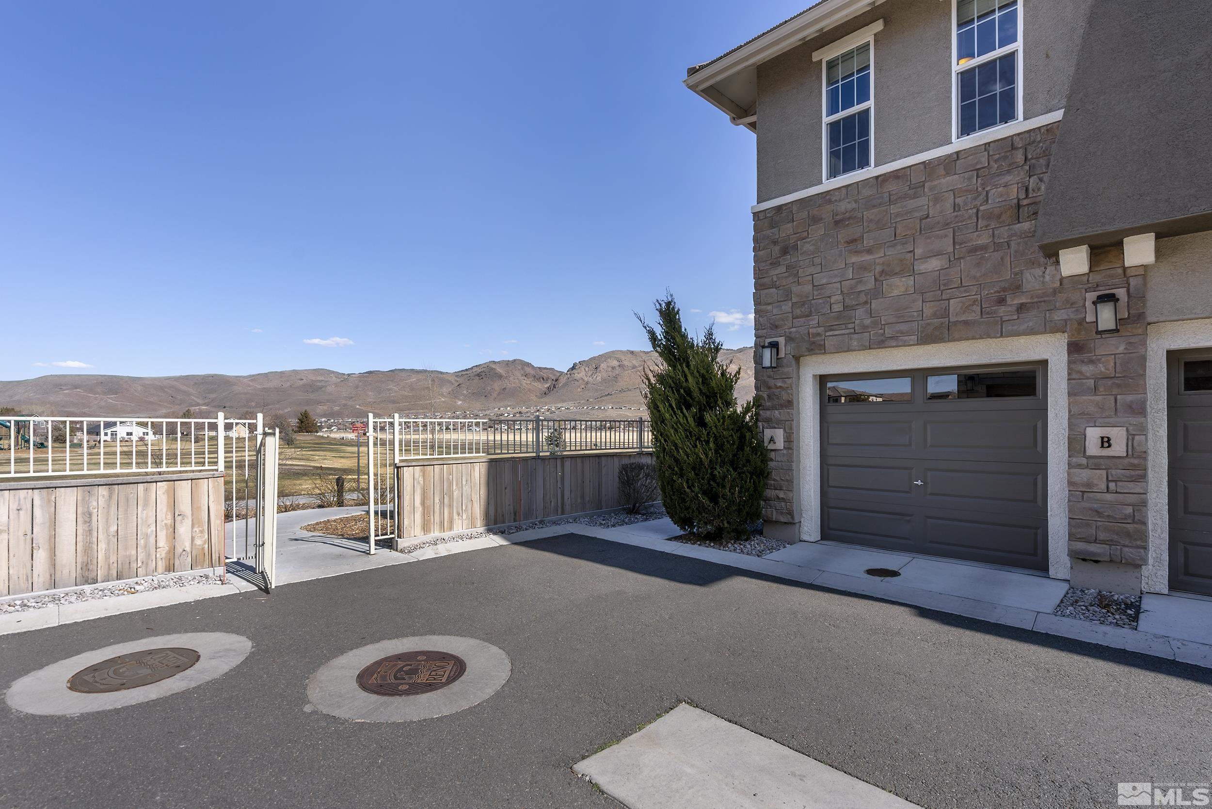 2037 Wind Ranch Road, Unit A Reno, NV 89521 - Photo 3 of 39 a view of a house with a swimming pool