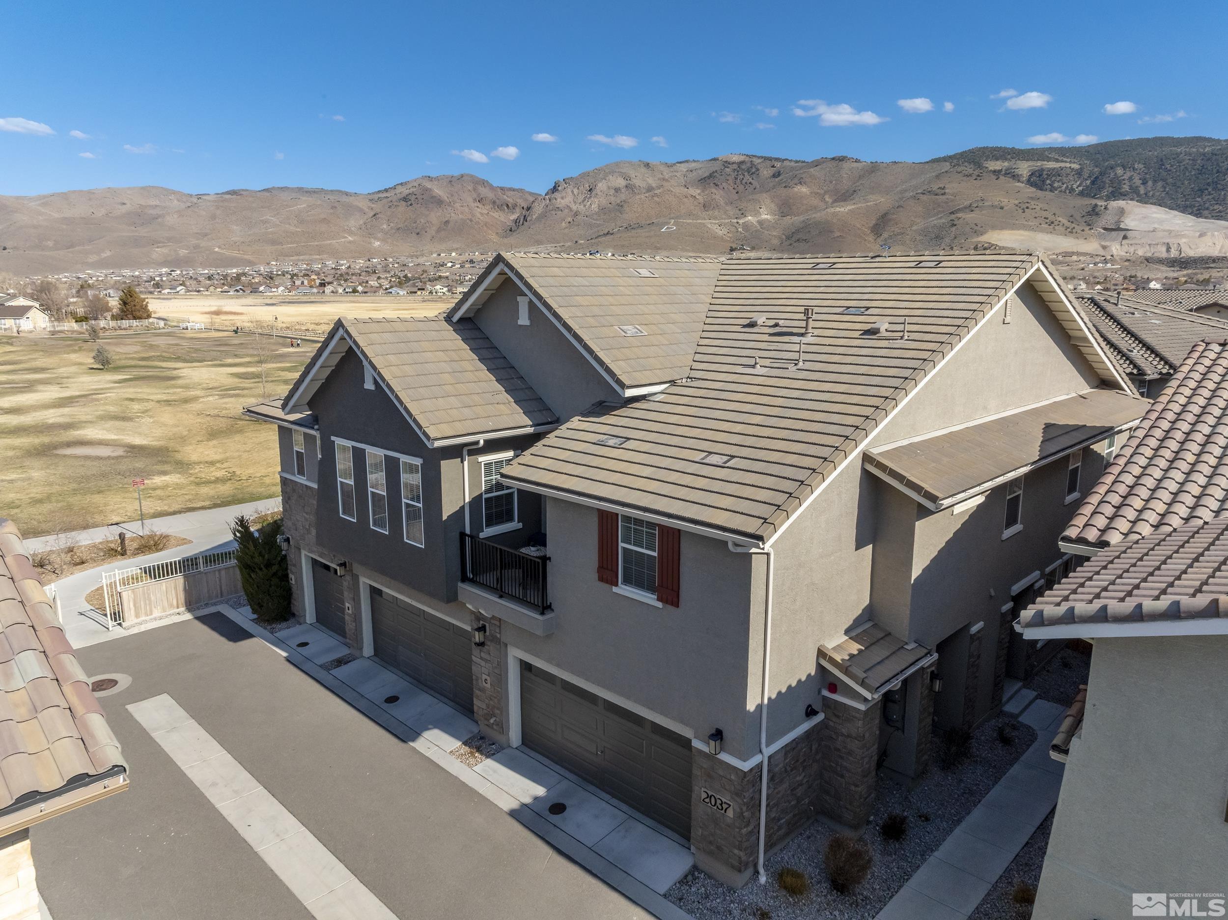 2037 Wind Ranch Road, Unit A Reno, NV 89521 - Photo 4 of 39 a view of houses with city view