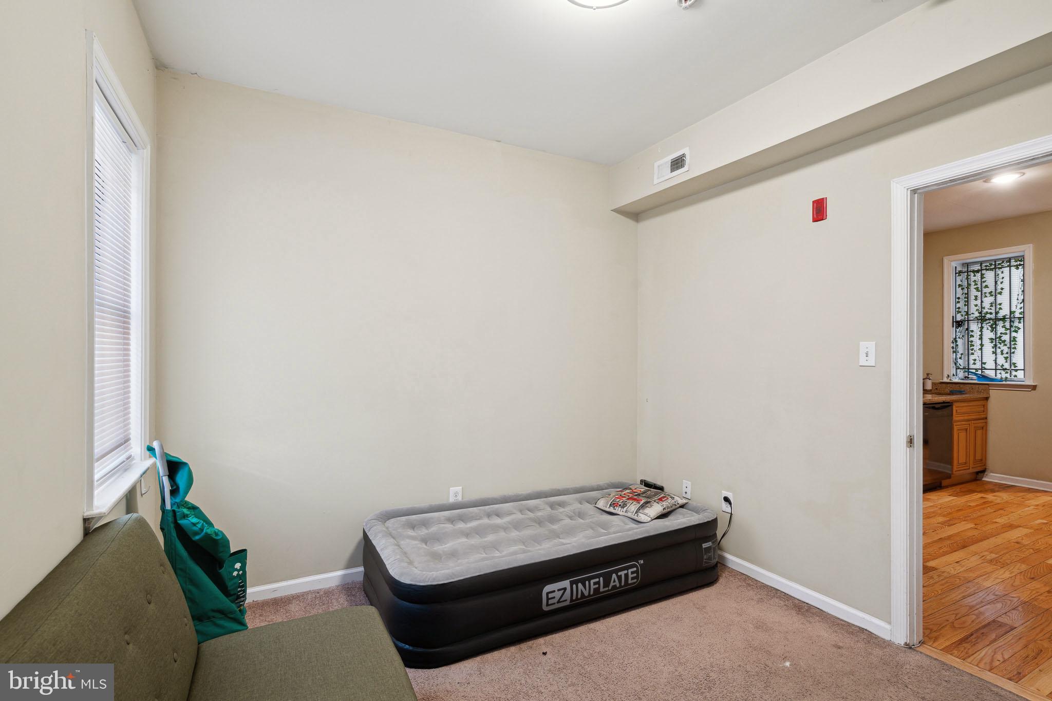 1611 North 17th Street, Unit 2 Philadelphia, PA 19121 - Photo 11 of 18 a room with furniture and a window