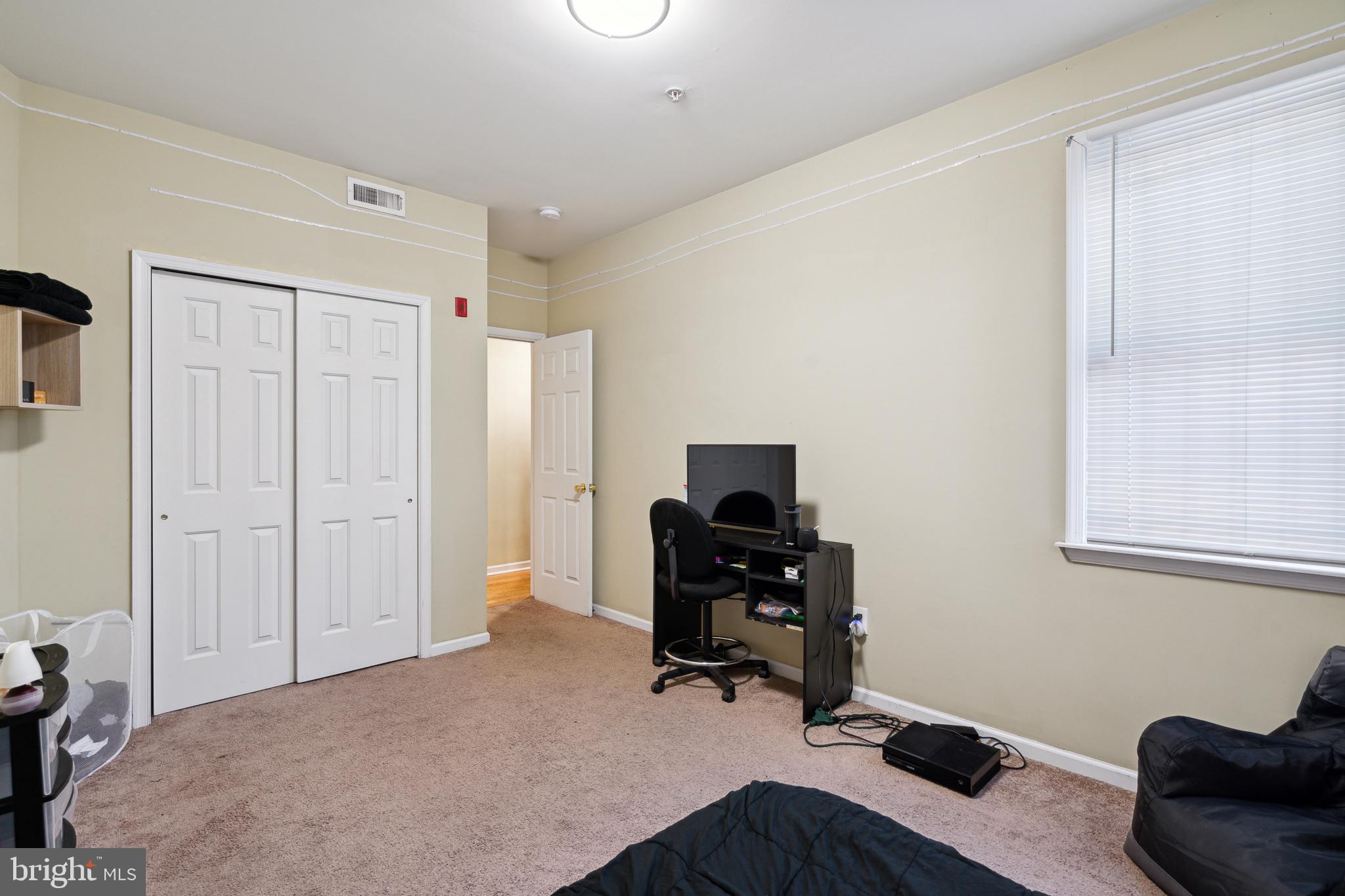 1611 North 17th Street, Unit 2 Philadelphia, PA 19121 - Photo 4 of 18 a livingroom with workspace and a window