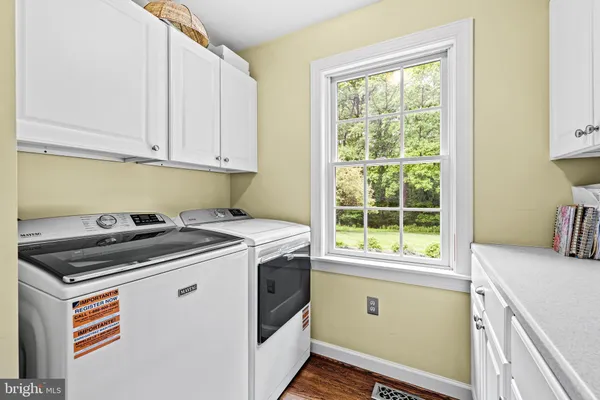 a utility room with washer and dryer
