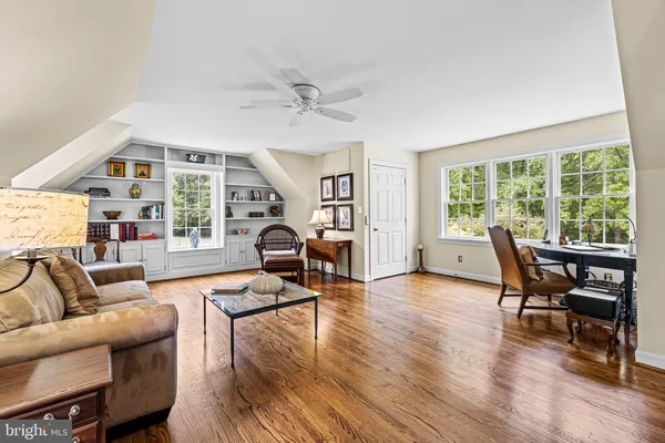 a spacious bathroom with a granite countertop sink toilet and shower