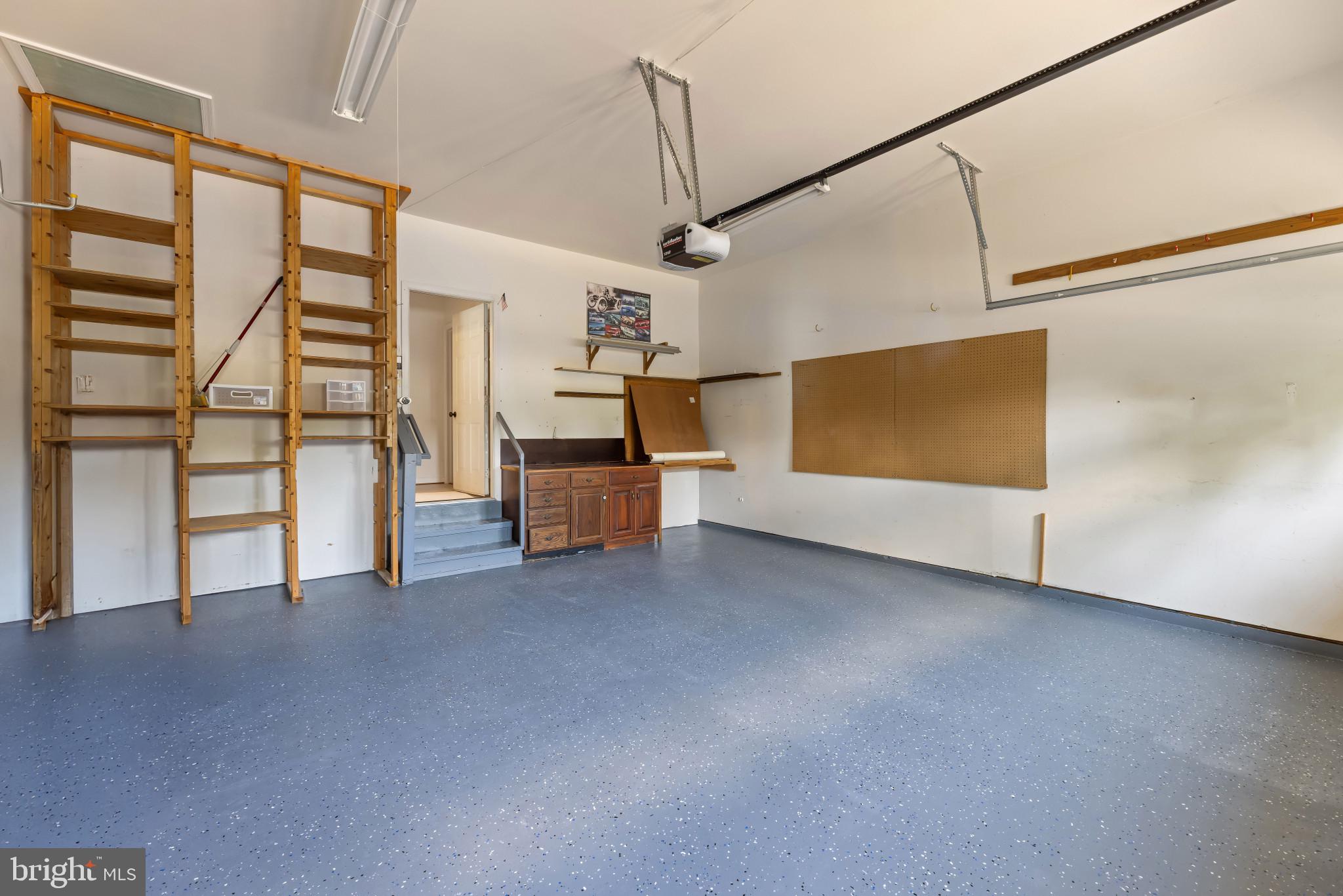 6934 Cumberstone Place Gainesville, VA 20155 - Photo 40 of 49 a view of empty room with stairs and wooden floor