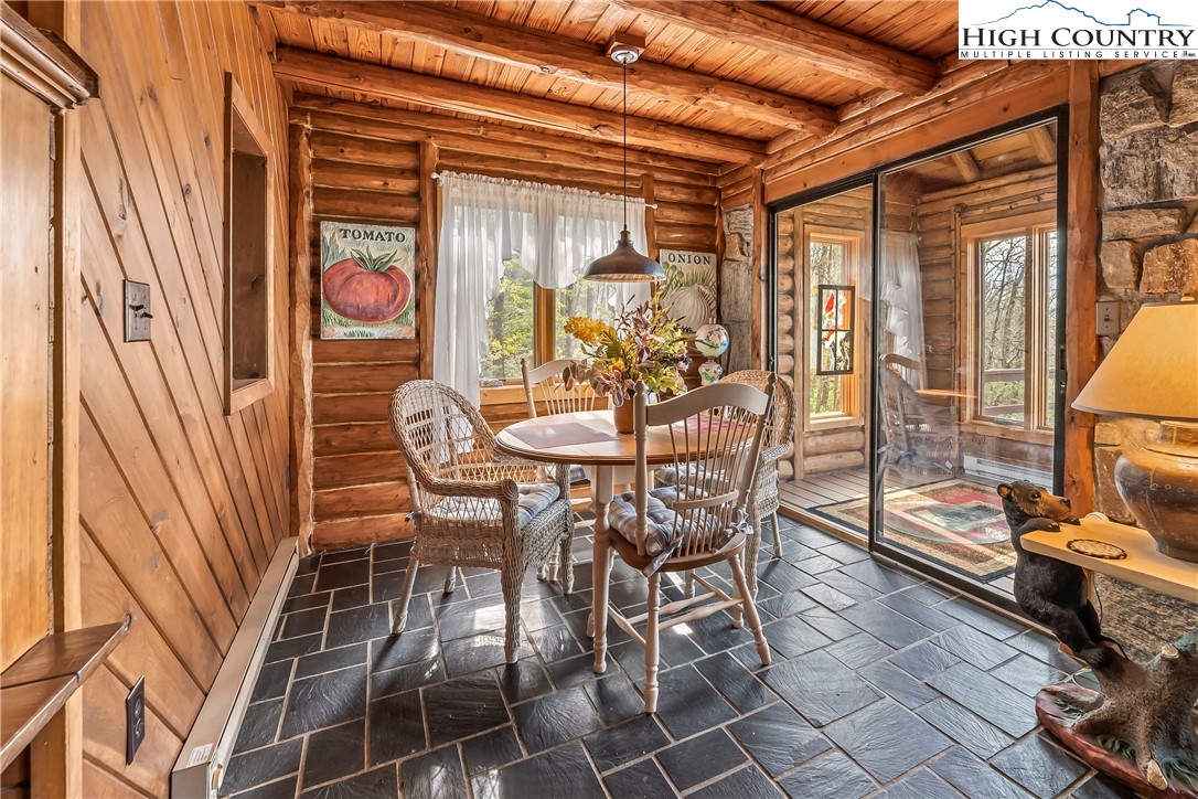 231 Deer Oaks Road Deep Gap, NC 28618 - Photo 13 of 44 a outdoor dining space with a table and chairs