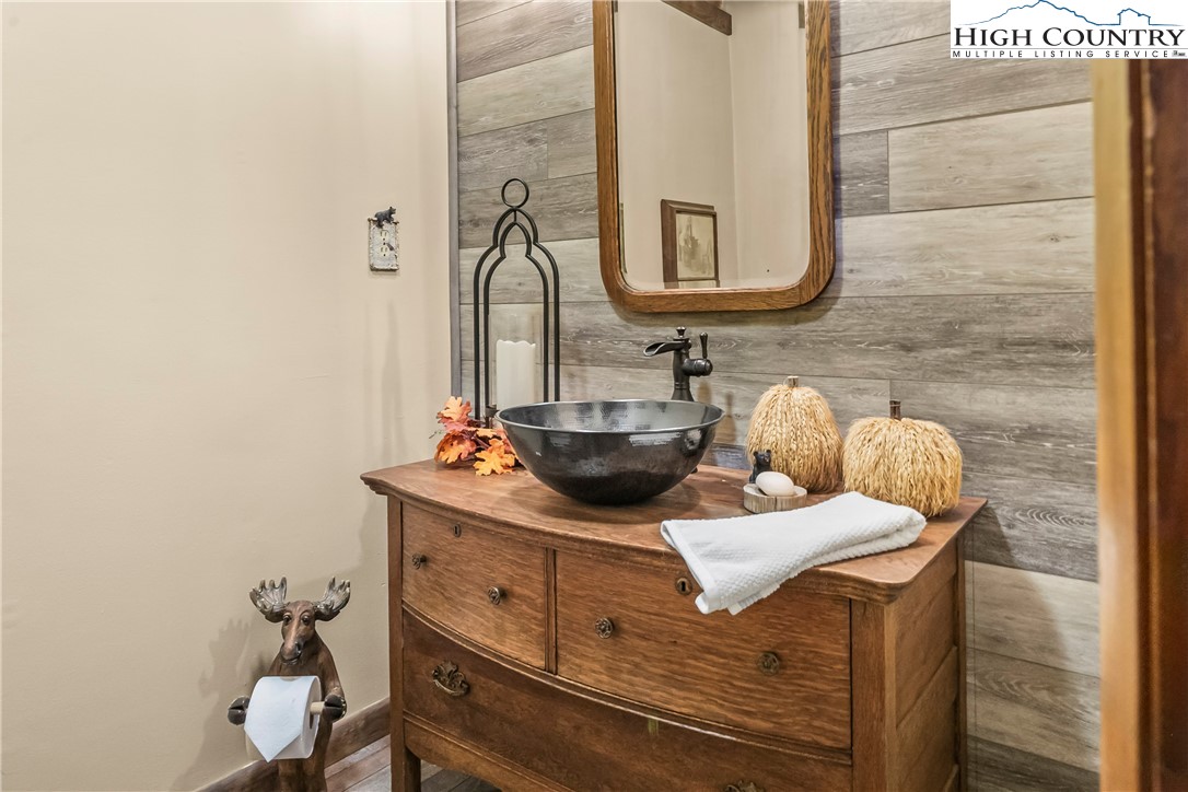 231 Deer Oaks Road Deep Gap, NC 28618 - Photo 18 of 44 a bathroom with a sink and a mirror