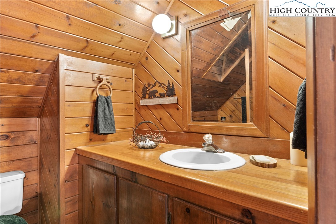 231 Deer Oaks Road Deep Gap, NC 28618 - Photo 21 of 44 a bathroom with a sink and a mirror