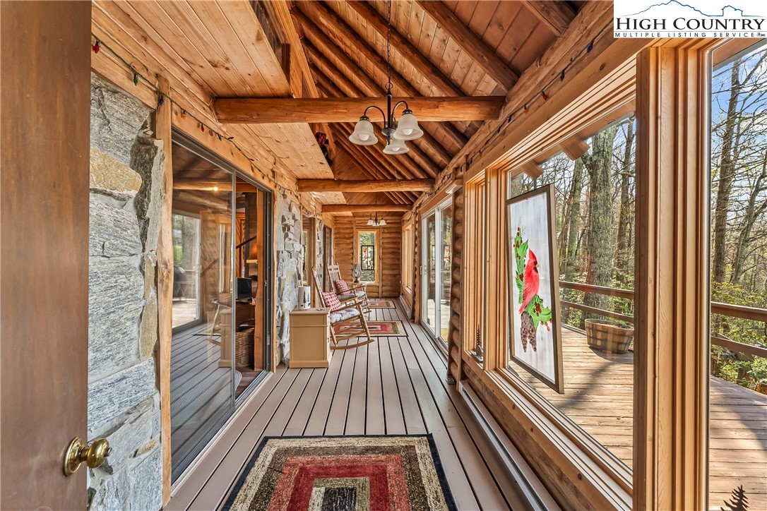 231 Deer Oaks Road Deep Gap, NC 28618 - Photo 23 of 44 a view of a balcony with wooden floor