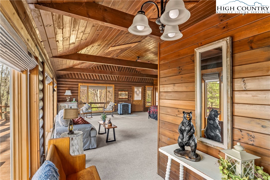 231 Deer Oaks Road Deep Gap, NC 28618 - Photo 24 of 44 a view of a chairs and table in a balcony