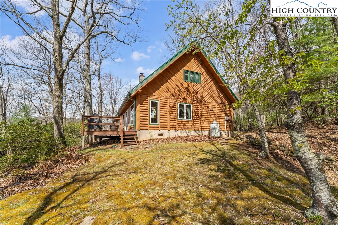 231 Deer Oaks Road Deep Gap, NC 28618 - Photo 35 of 44 a view of a house with a yard