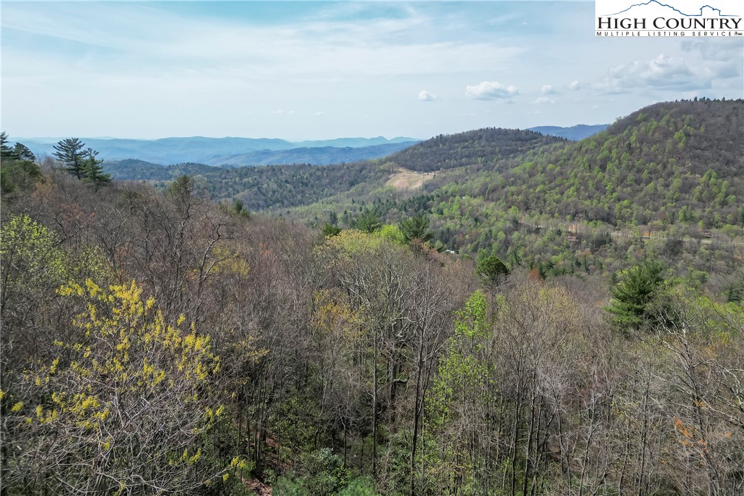 231 Deer Oaks Road Deep Gap, NC 28618 - Photo 38 of 44 a view of a town with mountains in the background