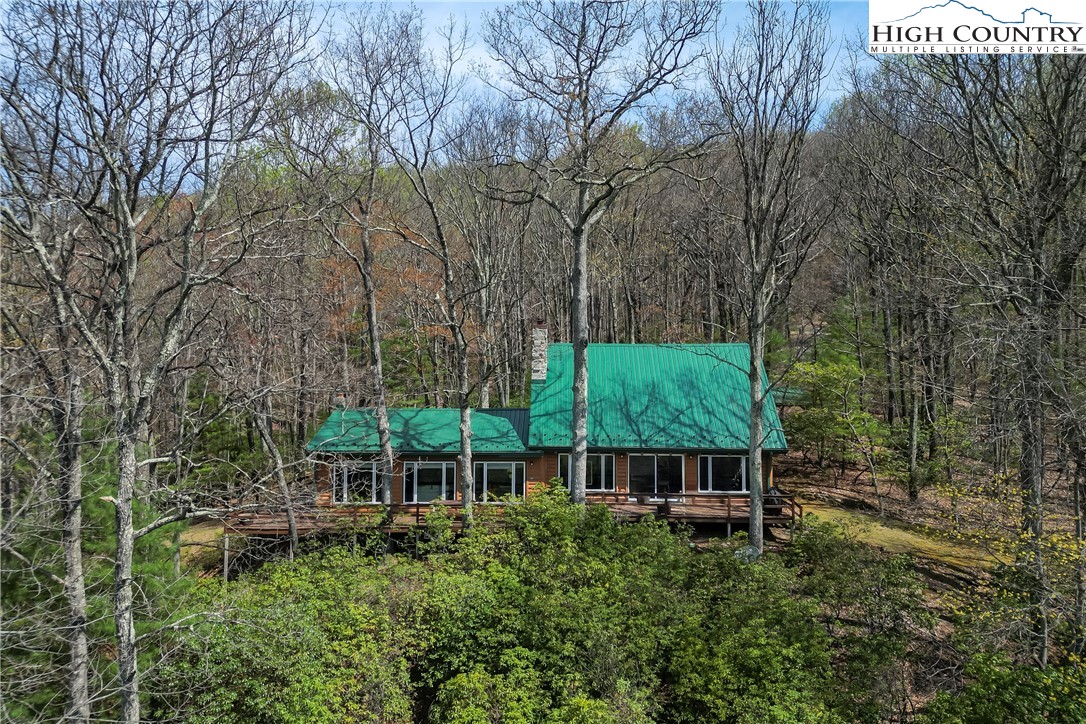231 Deer Oaks Road Deep Gap, NC 28618 - Photo 39 of 44 front view of a house with a yard