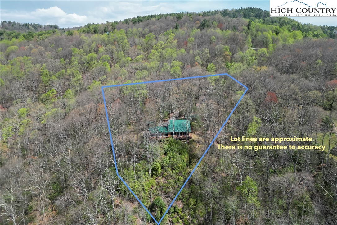 231 Deer Oaks Road Deep Gap, NC 28618 - Photo 41 of 44 a view of a houses with a yard