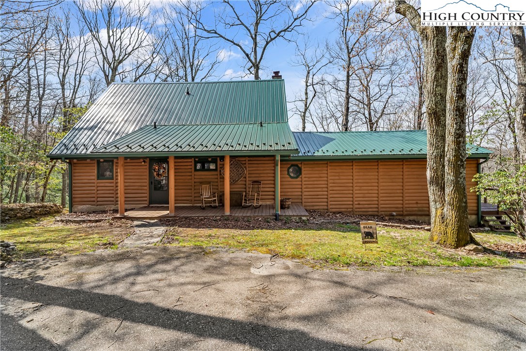 231 Deer Oaks Road Deep Gap, NC 28618 - Photo 42 of 44 a front view of a house having yard