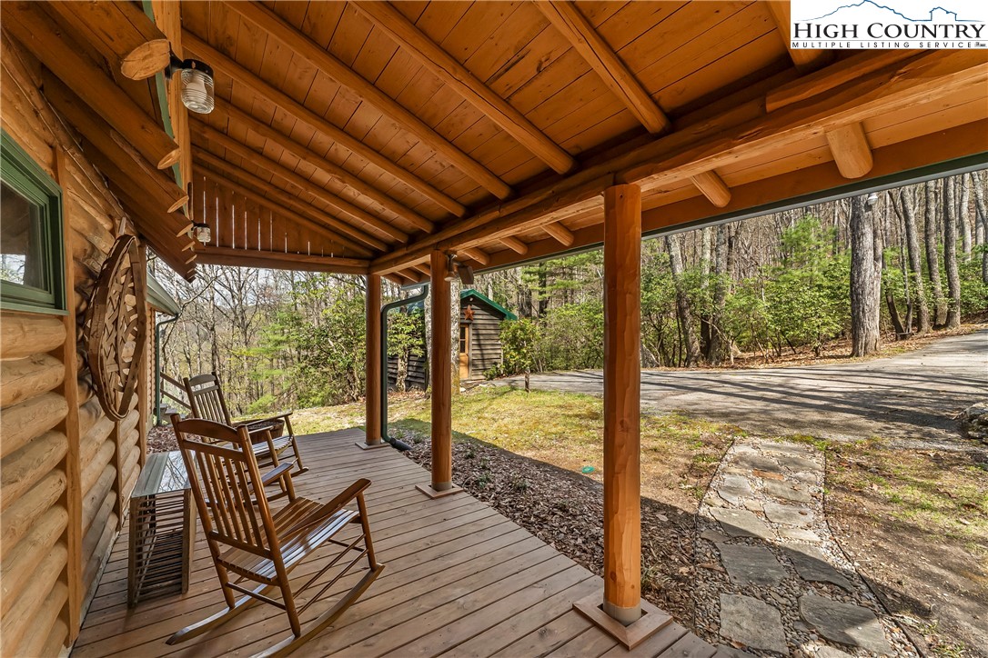 231 Deer Oaks Road Deep Gap, NC 28618 - Photo 7 of 44 a view of a porch with wooden floor
