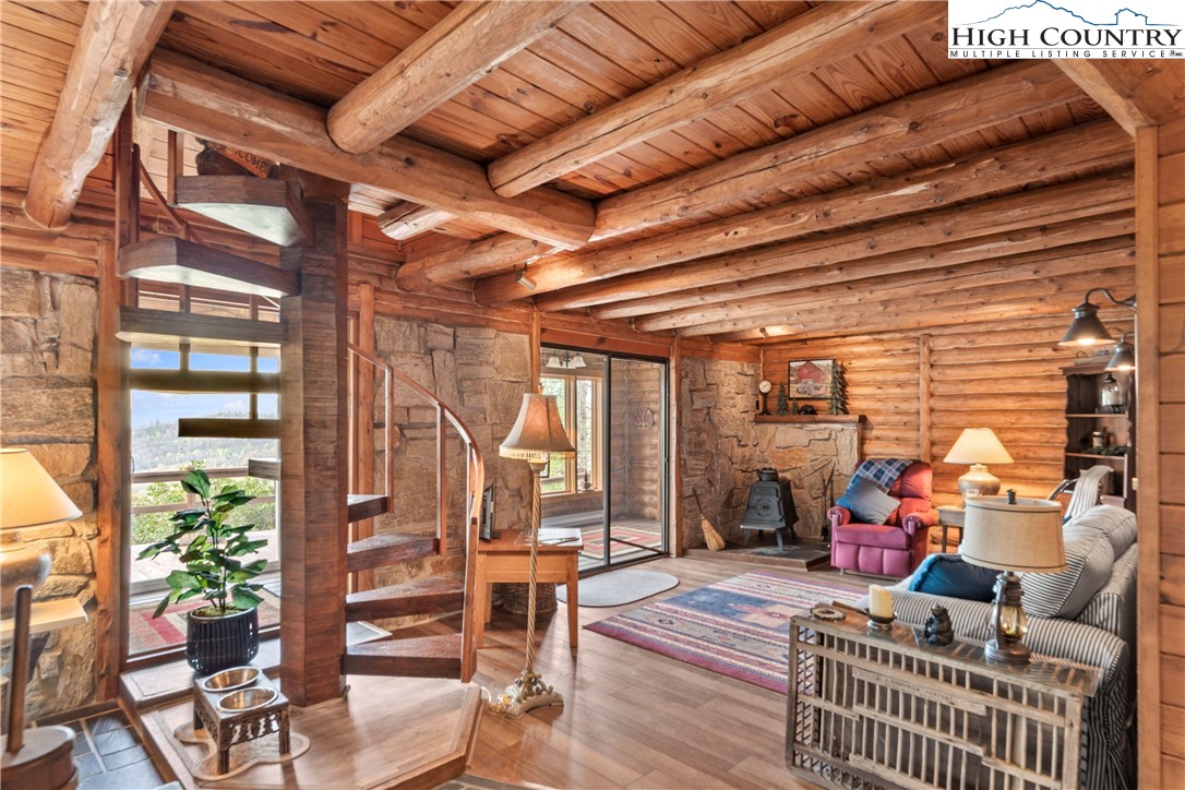 231 Deer Oaks Road Deep Gap, NC 28618 - Photo 10 of 44 a outdoor space with patio lots of furniture and plants