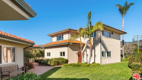 a kitchen with stainless steel appliances granite countertop a refrigerator a stove and a sink