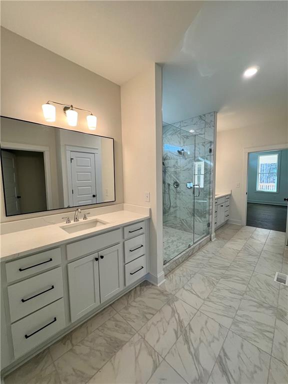 327 Primrose Lane Pendergrass, GA 30567 - Photo 19 of 41 a spacious bathroom with a granite countertop sink mirror and shower