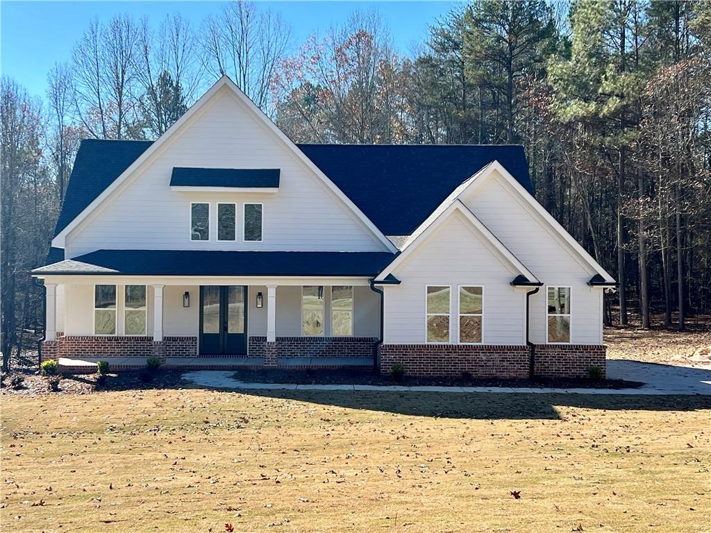 327 Primrose Lane Pendergrass, GA 30567 - Photo 2 of 41 a front view of a house with a yard