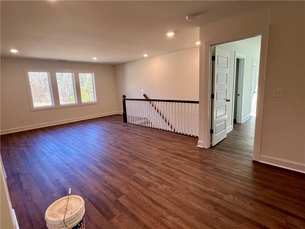 327 Primrose Lane Pendergrass, GA 30567 - Photo 23 of 41 a view of an empty room with wooden floor and window