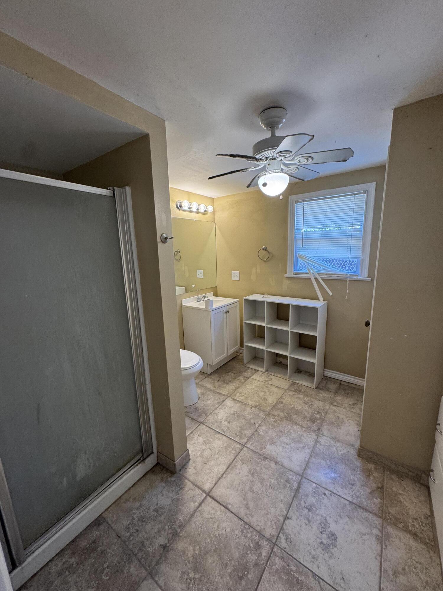 2708 20th Street, Unit REAR Lubbock, TX 79410 - Photo 10 of 10 a view of a livingroom with a furniture and a ceiling fan