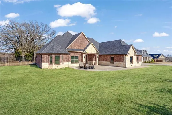 a front view of a house with a garden and porch