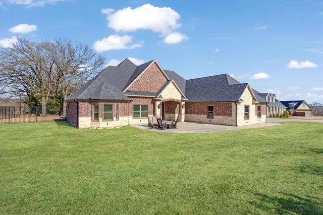 a front view of a house with a garden and porch