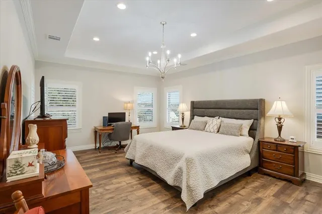 a large bedroom with bed and window