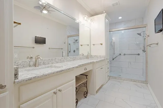 a bathroom with a granite countertop sink mirror and double