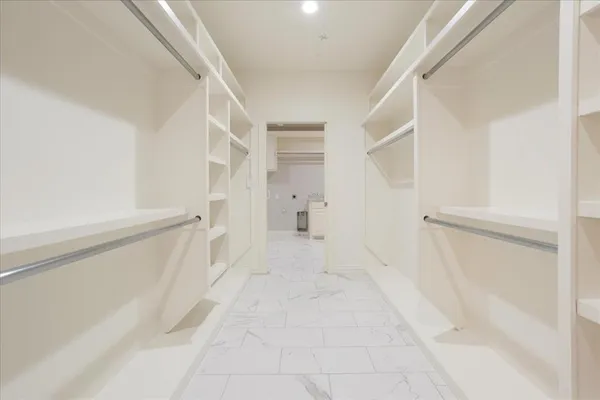 a view of an empty walk in closet