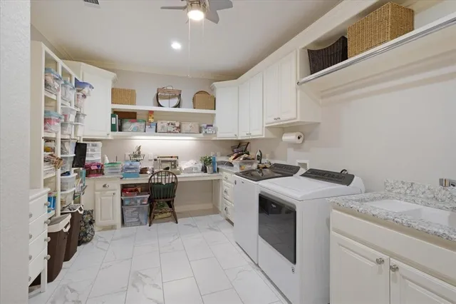 a kitchen with a stove sink and cabinets