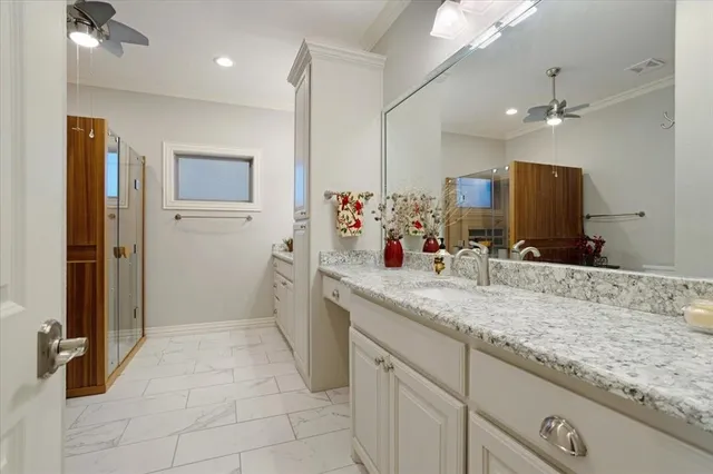 a bathroom with a sink double vanity and a mirror
